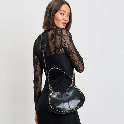 Rear view of model wearing black lace dress with Nova black studded shoulder bag