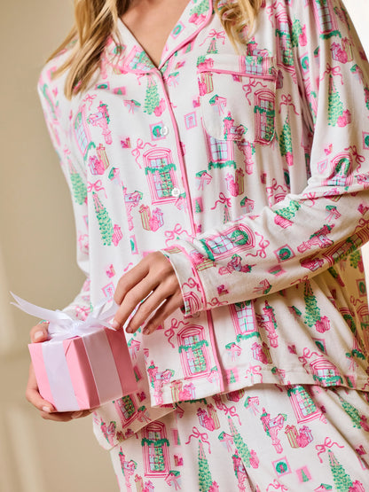 Detail of cream Christmas Cottage PJ top with pink piping and holiday print