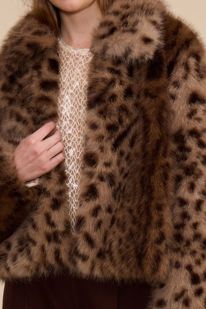 Close-up of brown leopard print faux fur jacket open front detail